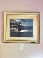 Full view of framed print on wall