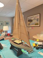 Starboard bow view showing hull, sail, and stand