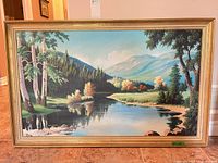 Full view of framed landscape painting