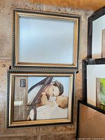 Pair of rectangular black and gold 8x10 frames