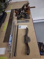 Group shot showing three planes, scraper, square, spokeshave and extension bits