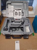 Tool and all accessories arranged inside open molded case