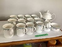 Full set: teapot, creamer, sugar bowl, 12 mugs