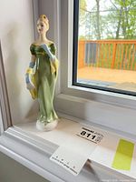 Front view of Royal Doulton Lorna figurine on windowsill