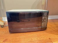 Front view showing entire Sanyo microwave, door and control panel