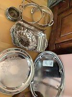 Group view of all silverplate items on table