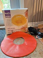 Boxed MedPro Plastic Sitz Bath with orange cushion and black hot air brush