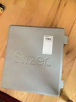 Closed grey case with Slitzer logo