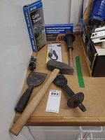 Lot overview showing boxed cable tracker, pressure tester, spark tester, hammer and chisels