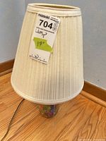 Full lamp showing pleated shade and mason jar base with cord