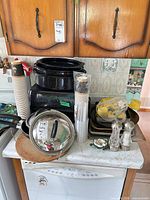 Full lot showing stacked roasters, baking sheets, cups, measuring set, grinders and trinket dishes