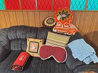 Overall lot on sofa showing six pillows and two throws