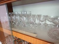 Shelf with assorted cut crystal stemware