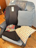 Group view of four pillows on chair