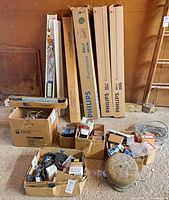 Overall lot with boxed Philips fixtures, loose housings, boxes of ballasts and electrical parts, conduit coils, ceiling light