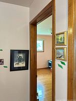 Overview showing Inuit print and two small landscape paintings