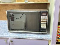 Front view of Panasonic microwave showing door and control panel