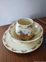 Trio stacked: mug inside bowl on plate showing overall design and colour
