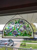 Full view of stained glass style iris window panel hanging