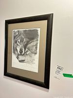 Framed print on wall showing frame and mat