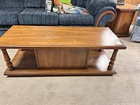 Full view of rectangular coffee table in front of sofa