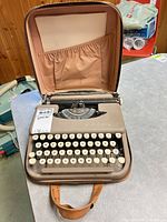 Typewriter in open carrying case