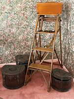 Overall lot showing ladder, three round boxes, document box on top