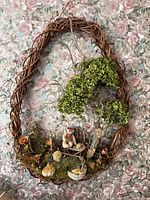 Full view of oval grapevine wreath with all decorative elements