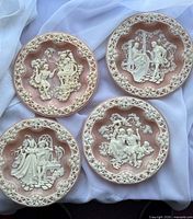 Front view of all four cameo relief plates