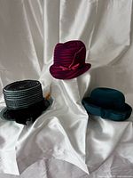 Group shot of all three hats showing colours, shapes, and general condition