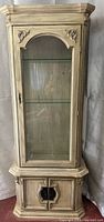 Front view of closed curio cabinet