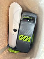 Top view of FoodSaver vacuum sealer and mandoline slicer inside bag