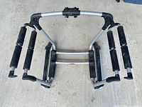 Overall view of Thule aluminum carrier with padded rollers and mounting bracket