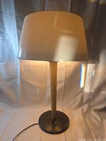 Full view of Lightolier table lamp showing base, column and shade