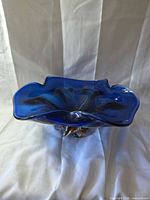 Overhead view of cobalt blue sommerso art glass bowl showing undulating rim