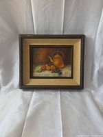 Frontal view of framed still life oil painting