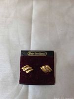 front view of The Limited gold-tone stud earrings on card