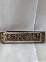 Front view showing engraved branding and wood comb