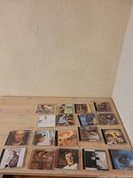 All 18 CDs laid out on tabletop
