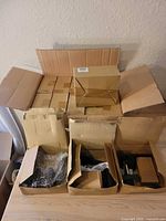Stacked cartons containing 14 boxed door lever sets