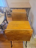 Two desks aligned showing backrests and iron legs