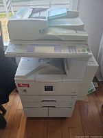 Full view of Ricoh Aficio 2022 copier showing ADF, control panel, paper trays