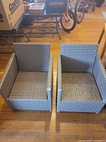 Front view of both gray child-size wicker chairs