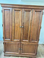 Front view closed showing paneled doors and hardware