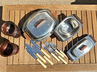 Full lot showing all serving dishes with lids, flatware and goblets
