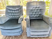 Front view of both chairs showing upholstery, tufting and skirted bases