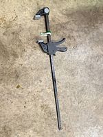 Full view of 24-inch Pittsburgh ratchet bar clamp on concrete floor