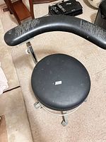 Top view showing round seat and cracked vinyl backrest
