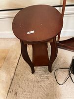 Full view of round top, legs, and shelf