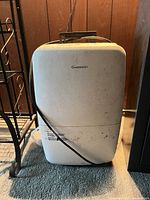Front view of white Garrison dehumidifier showing overall wear